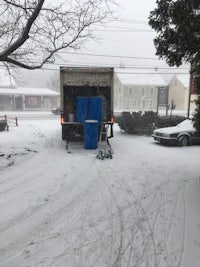 a truck is parked on a snowy street